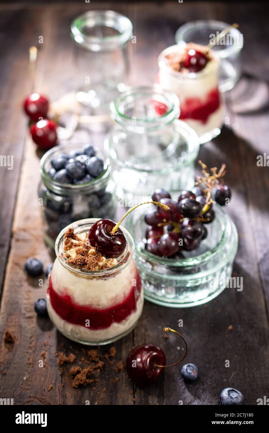 Fruit natural yoghurt with raspberries blueberries and grapes.Healthy