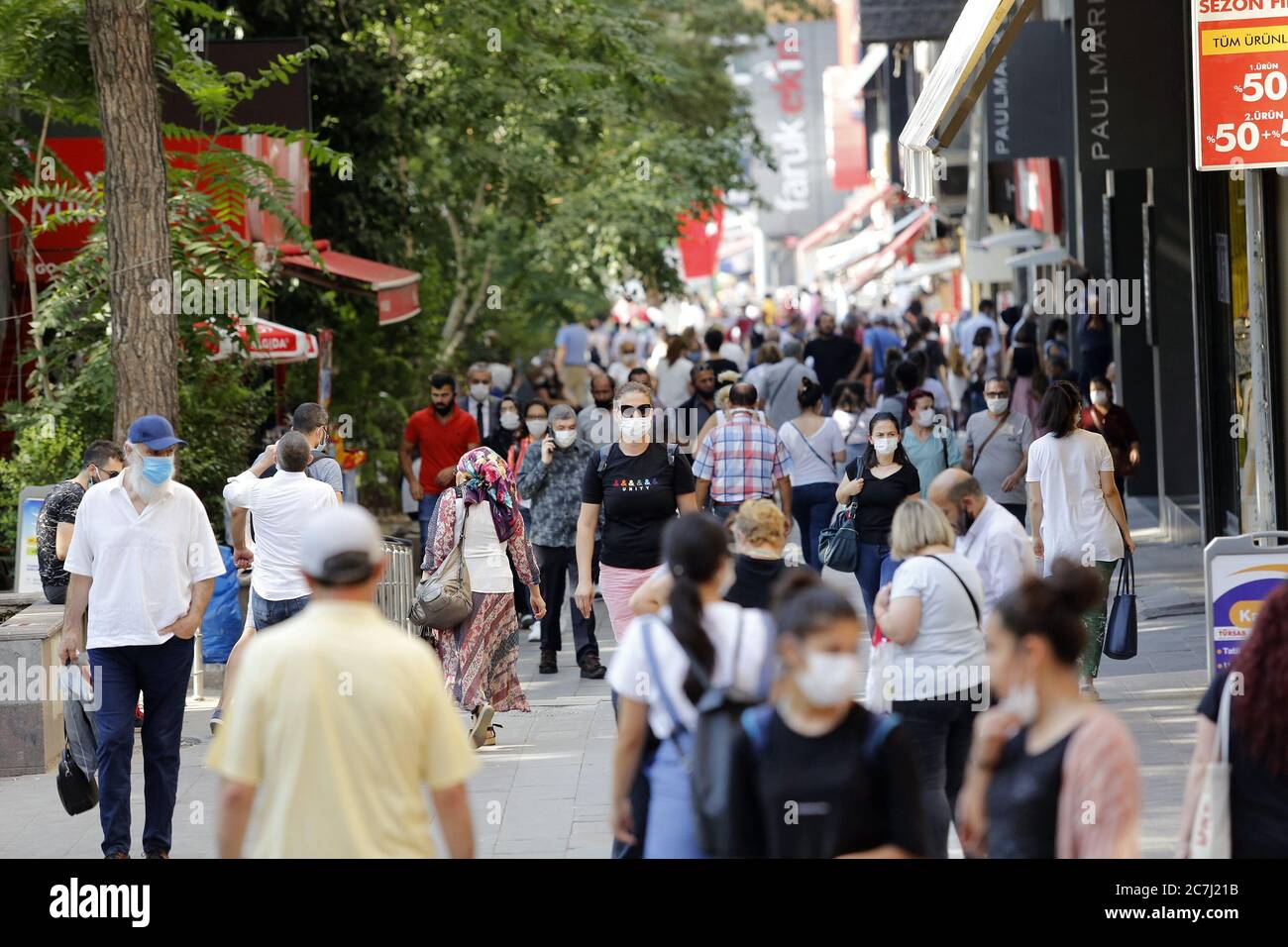 Ankara, Turkey. 17th July, 2020. People wearing face masks are seen on a street in Ankara, Turkey, on July 17, 2020. Turkish Health Minister Fahrettin Koca on Friday warned of the increasing number of intensive care and intubated COVID-19 patients in the country. Turkey's daily coronavirus cases increased by 926 on Friday, raising the overall number to 217,799, the minister said. Credit: Mustafa Kaya/Xinhua/Alamy Live News Stock Photo