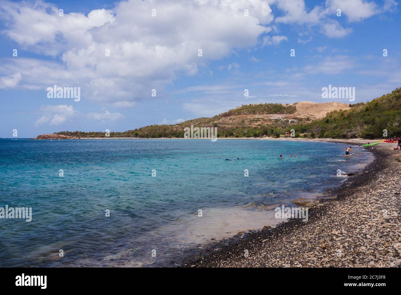 Tourists swimming in Caribbean Sea at Playa Tamarindo in Culebra, Puerto Rico Stock Photo