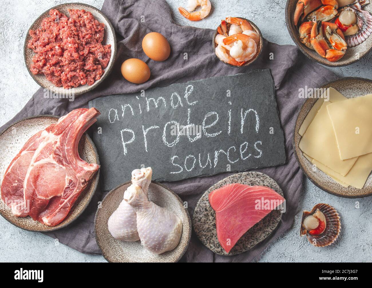 Animal protein sources background with copy space. Carnivore diet concept. Meat, cheese, fish, eggs and seafood Stock Photo