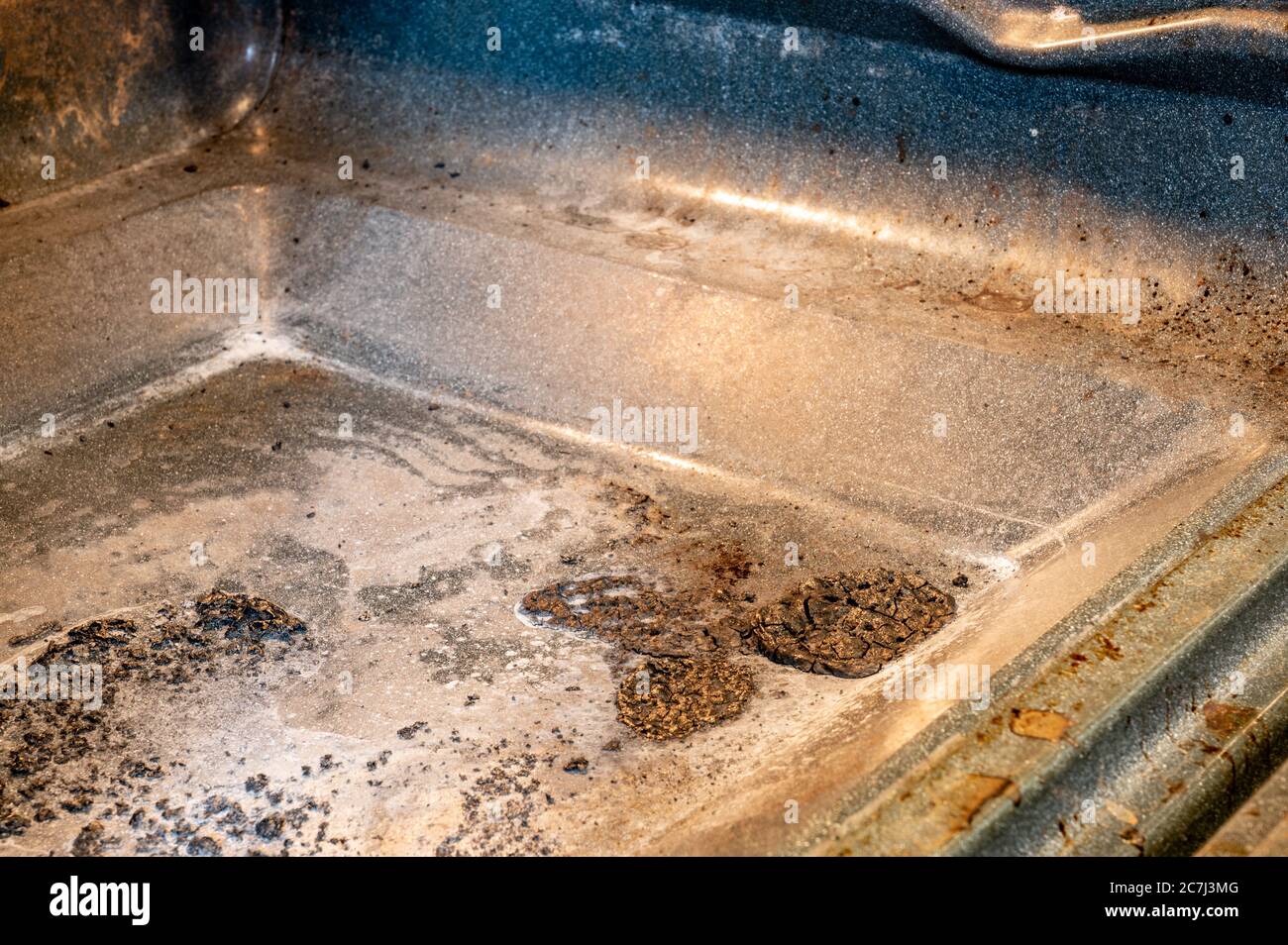 Inside picture of an oven to show burnt food and grease in need of