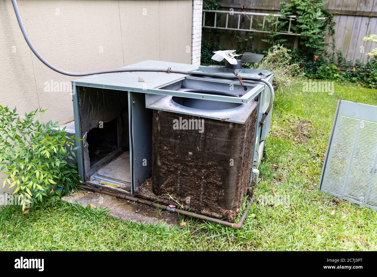 Air Conditioner system with dirty Condenser coils that need to be cleaned Stock Photo