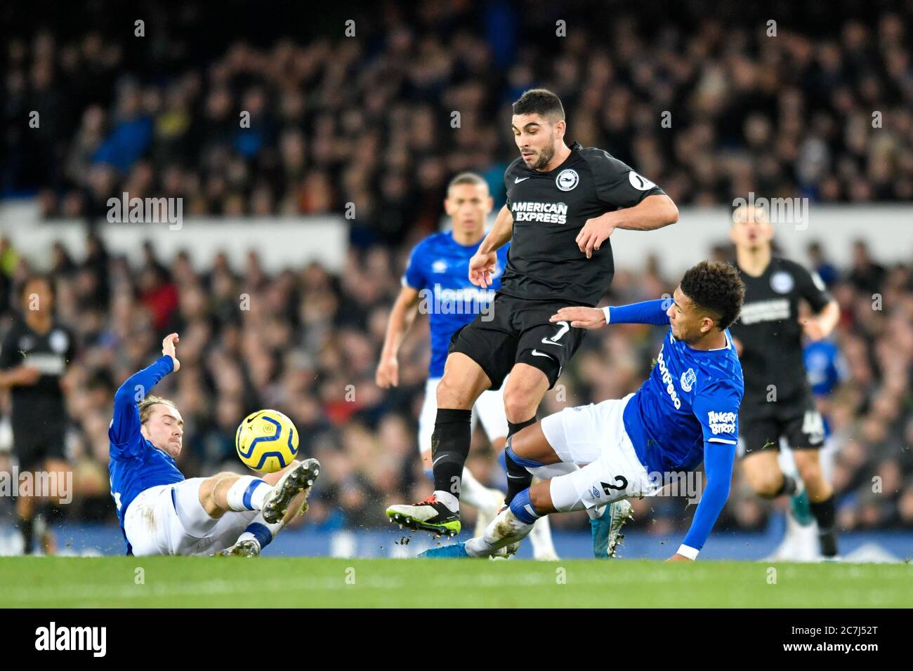 11th January 2020, Goodison Park, Liverpool, England; Premier League, Everton v Brighton and Hove Albion : Neal Maupay (7) of Brighton and Hove Albion attempts to avoid the sliding tackles from Tom Davies (26) and Mason Holgate (2) of Everton Credit: Simon Whitehead/News Images Stock Photo