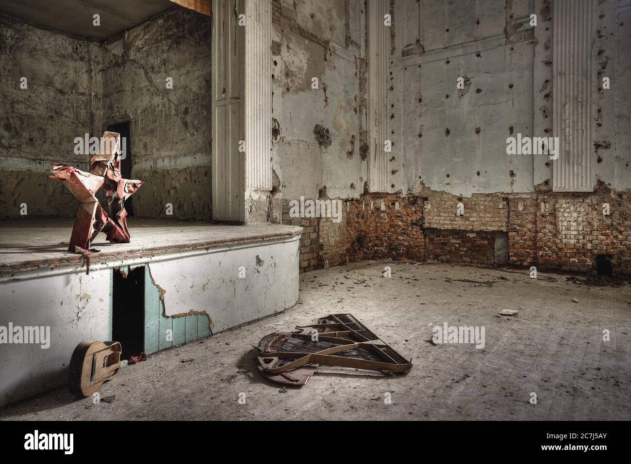 Old musical instruments inside an abandoned building with rusty walls ...