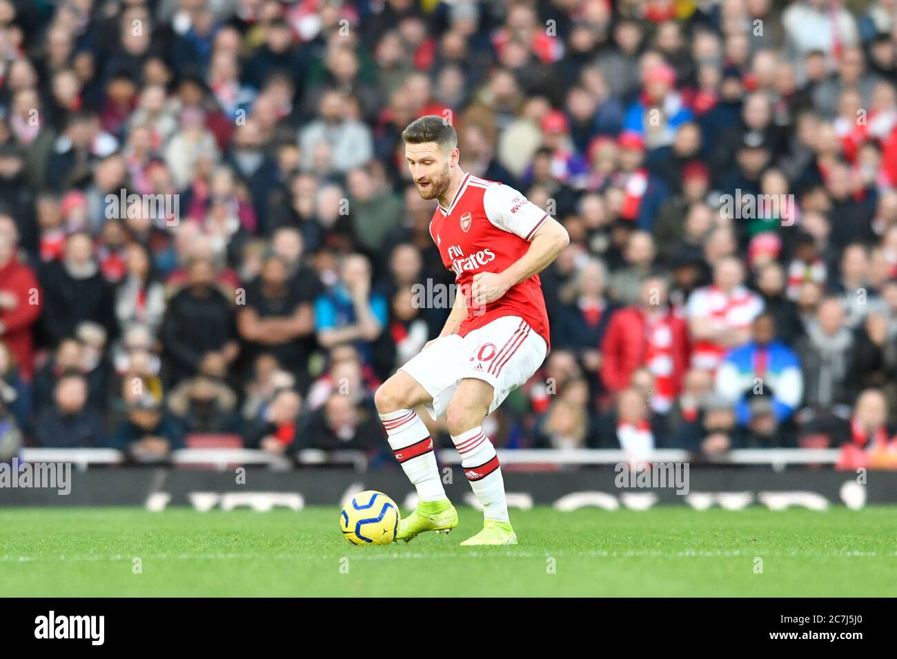 18th January 2020, Emirates Stadium, London, England; Premier League, Arsenal v Sheffield United : Shkodran Mustafi (20) of Arsenal passes the ball Credit: Simon Whitehead/News Images Stock Photo