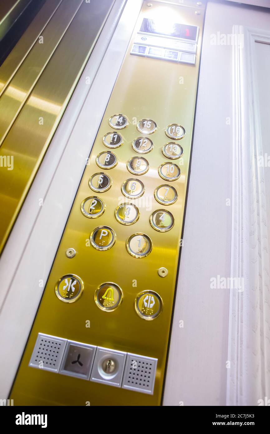 Gilded buttons for selecting floors in the elevator Stock Photo