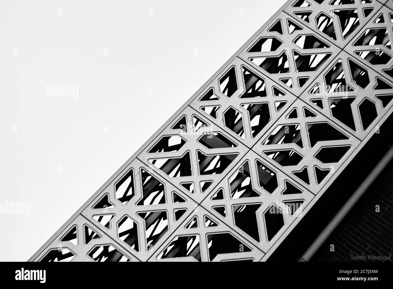 Greyscale shot of a patterned construction with a white background Stock Photo
