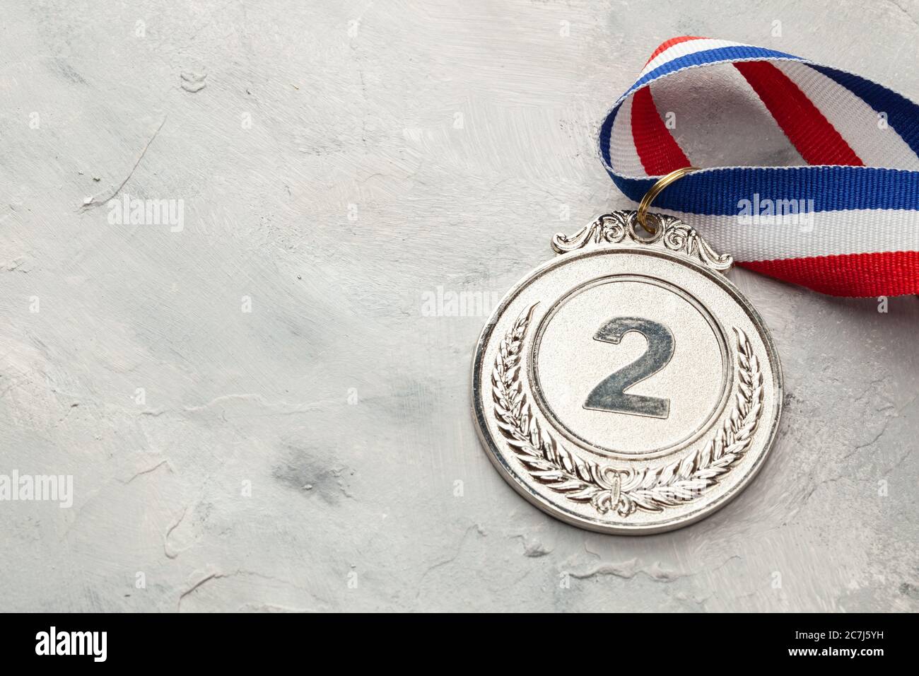 Silver medal. Second place award with ribbon Stock Photo - Alamy
