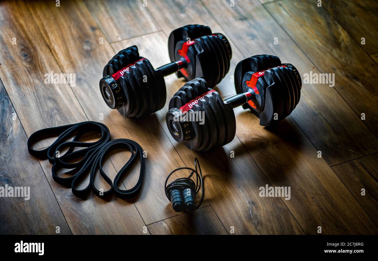 Home workout equipment including dumbbells, skipping rope and resistance bands Stock Photo