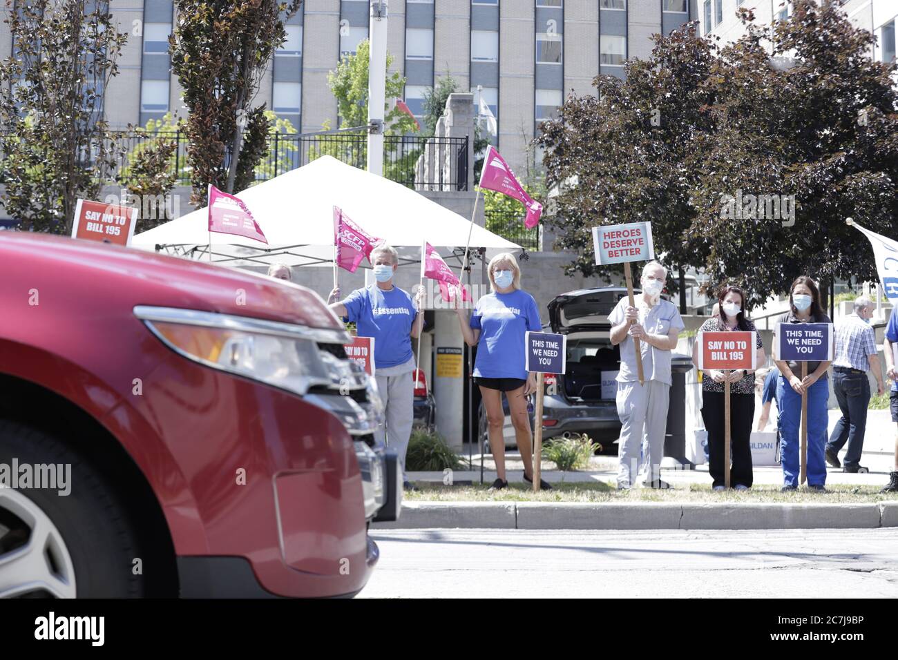 Angry Healthcare workers seen protesting at street side against Bill 195 amidst working in Covid-19 crisis Stock Photo