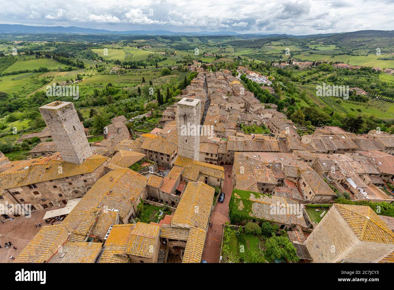 View of San Gimignano from the tallest tower, Torre Grossa. San Gimignano is a small Italian town in Tuscany with a medieval town center. San Gimignano is also called 'Medieval Manhattan' or the 'City of Towers'. Stock Photo
