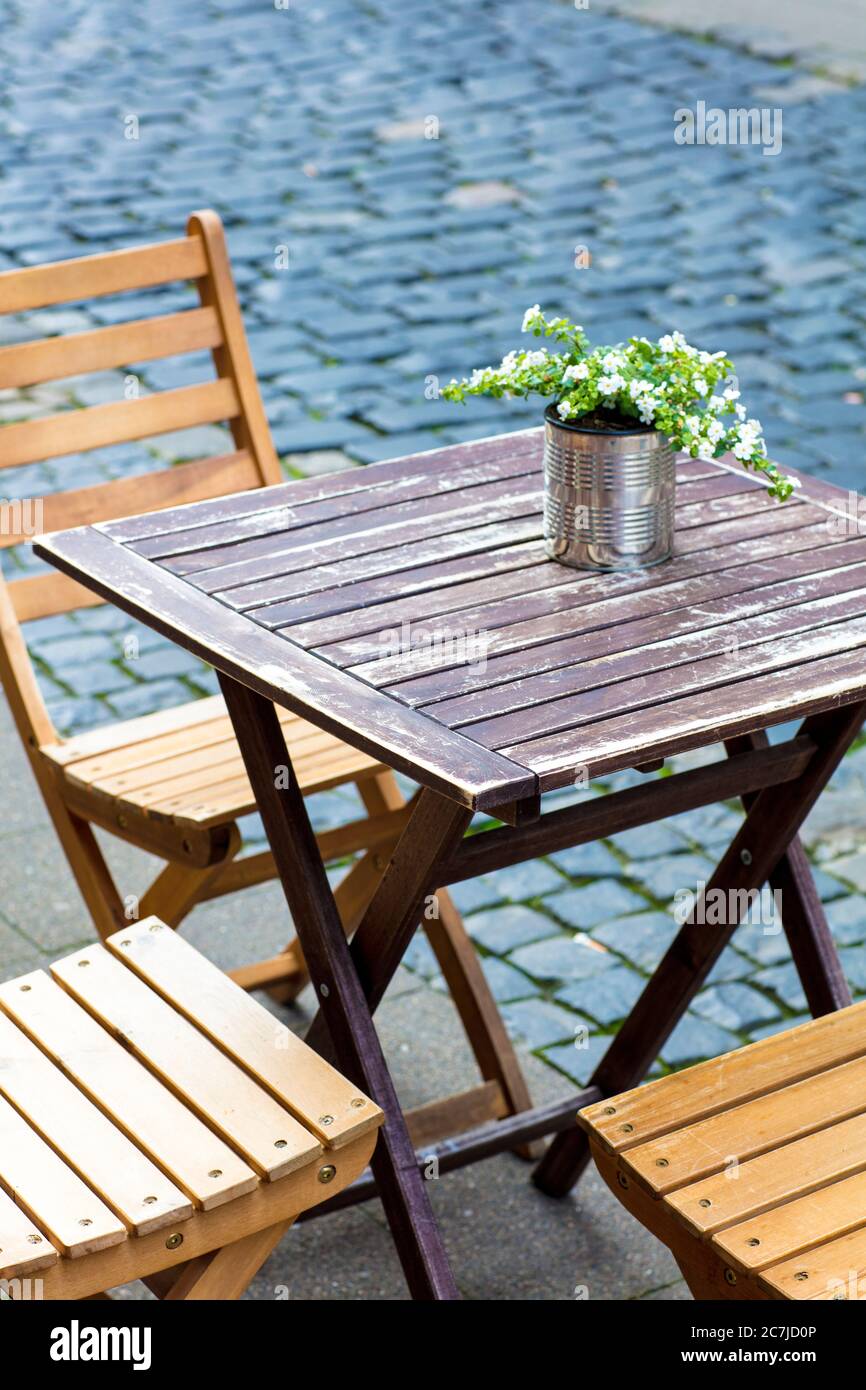 Table, chairs, flowers, decoration, gastronomy, street cafe, Braunschweig, Lower Saxony, Germany, Europe Stock Photo