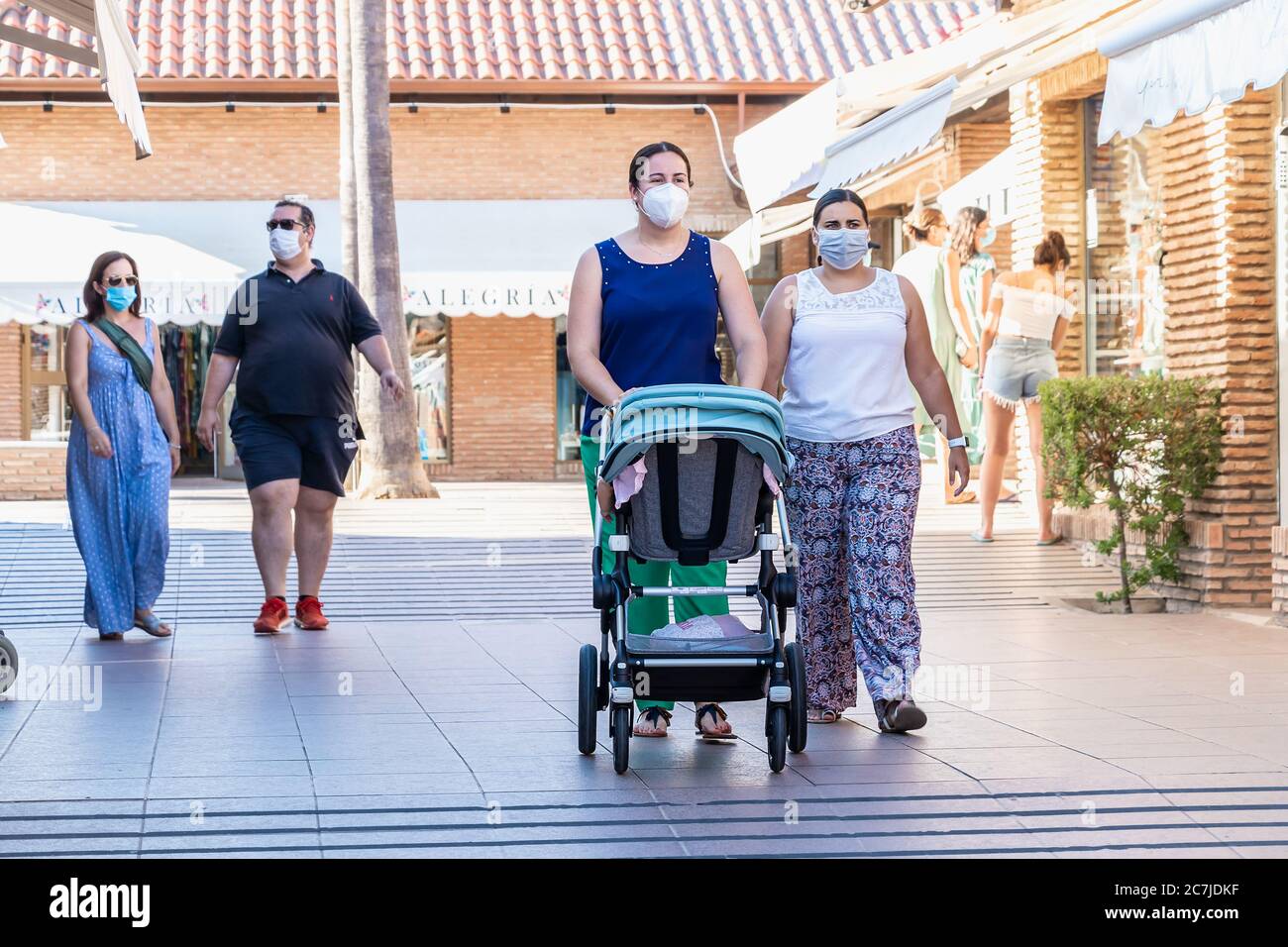 Huelva, Spain July 4, 2020 Two women wearing protective face mask