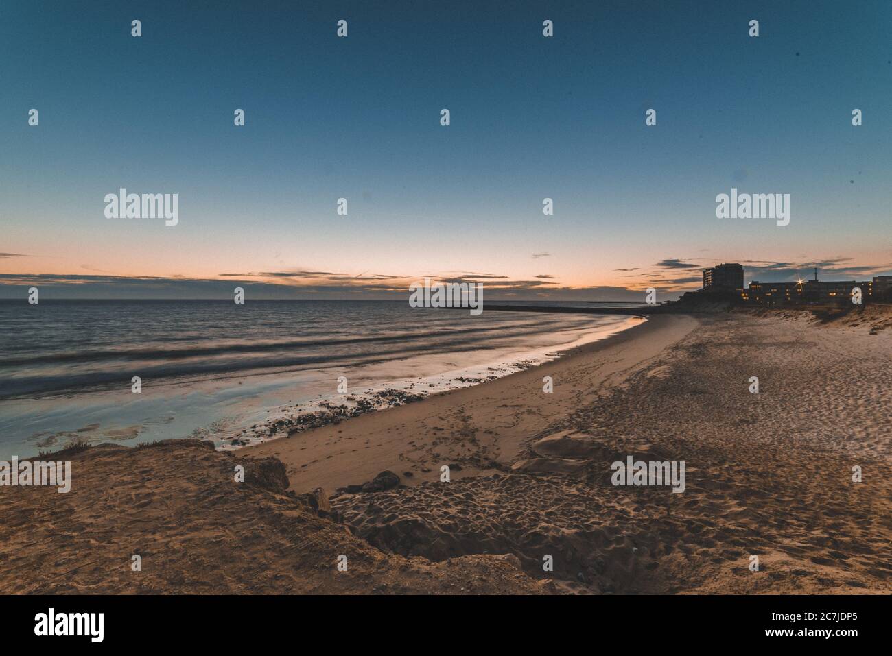 Beautiful scenery of the sunset reflecting in the sea Stock Photo - Alamy