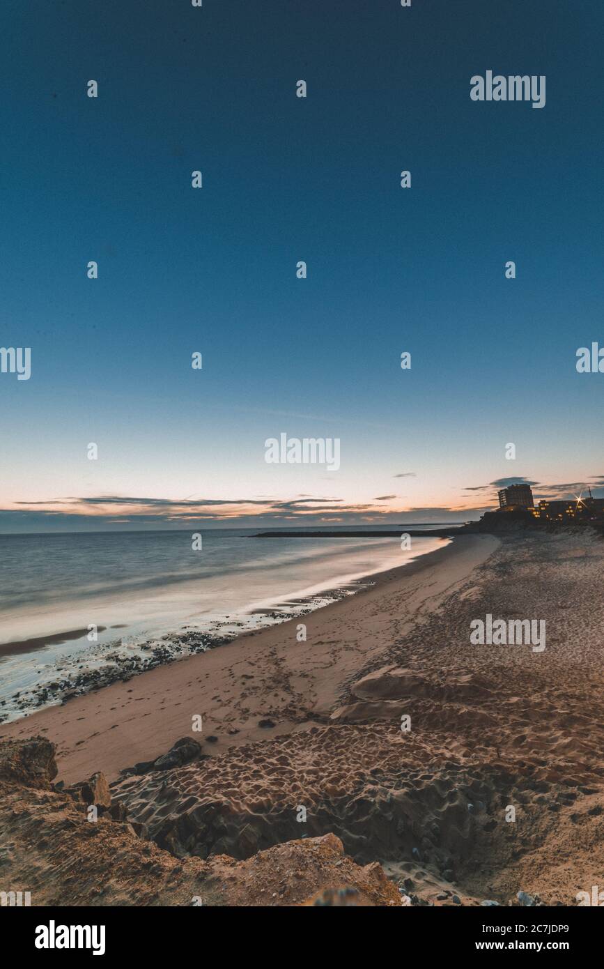 Beautiful scenery of the sunset reflecting in the sea Stock Photo - Alamy