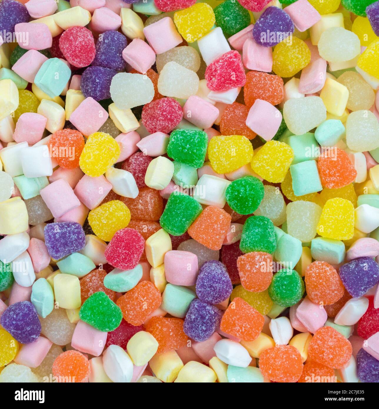 https://c8.alamy.com/comp/2C7JE35/background-texture-close-up-of-a-jumble-of-colorful-gumdrops-and-pastel-candy-dinner-mints-viewed-from-above-2C7JE35.jpg