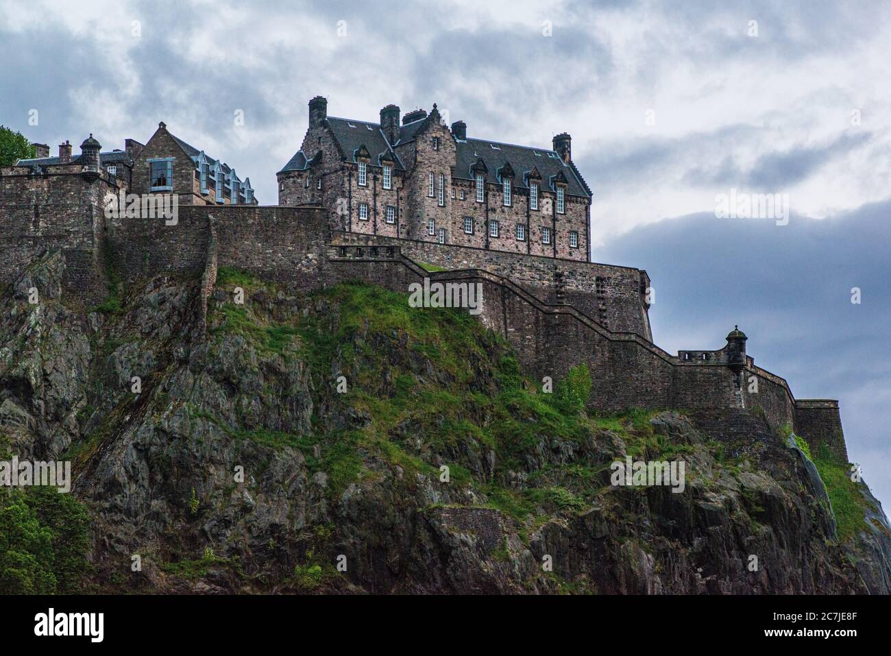 Edinburgh Castle sitting atop Castle Rock in Edinburgh, Scotland is an