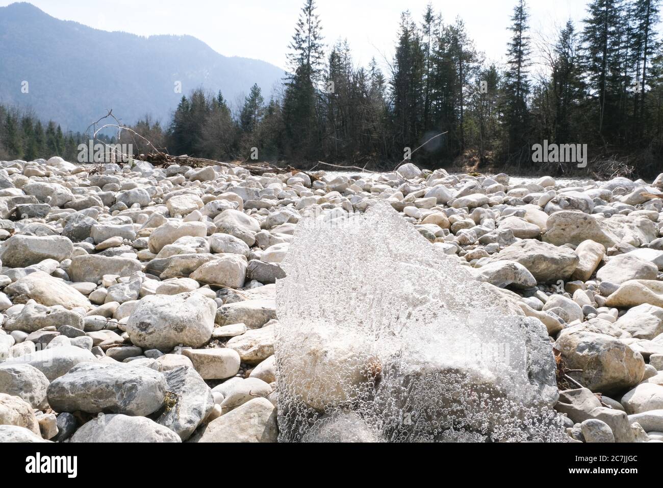 Ice, river bed, stones Stock Photo