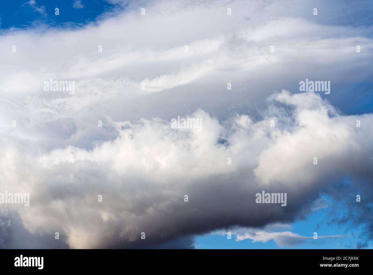 Dramatic thunderstorm clouds in blue sky before rain. Natural weather cloudscape background Stock Photo