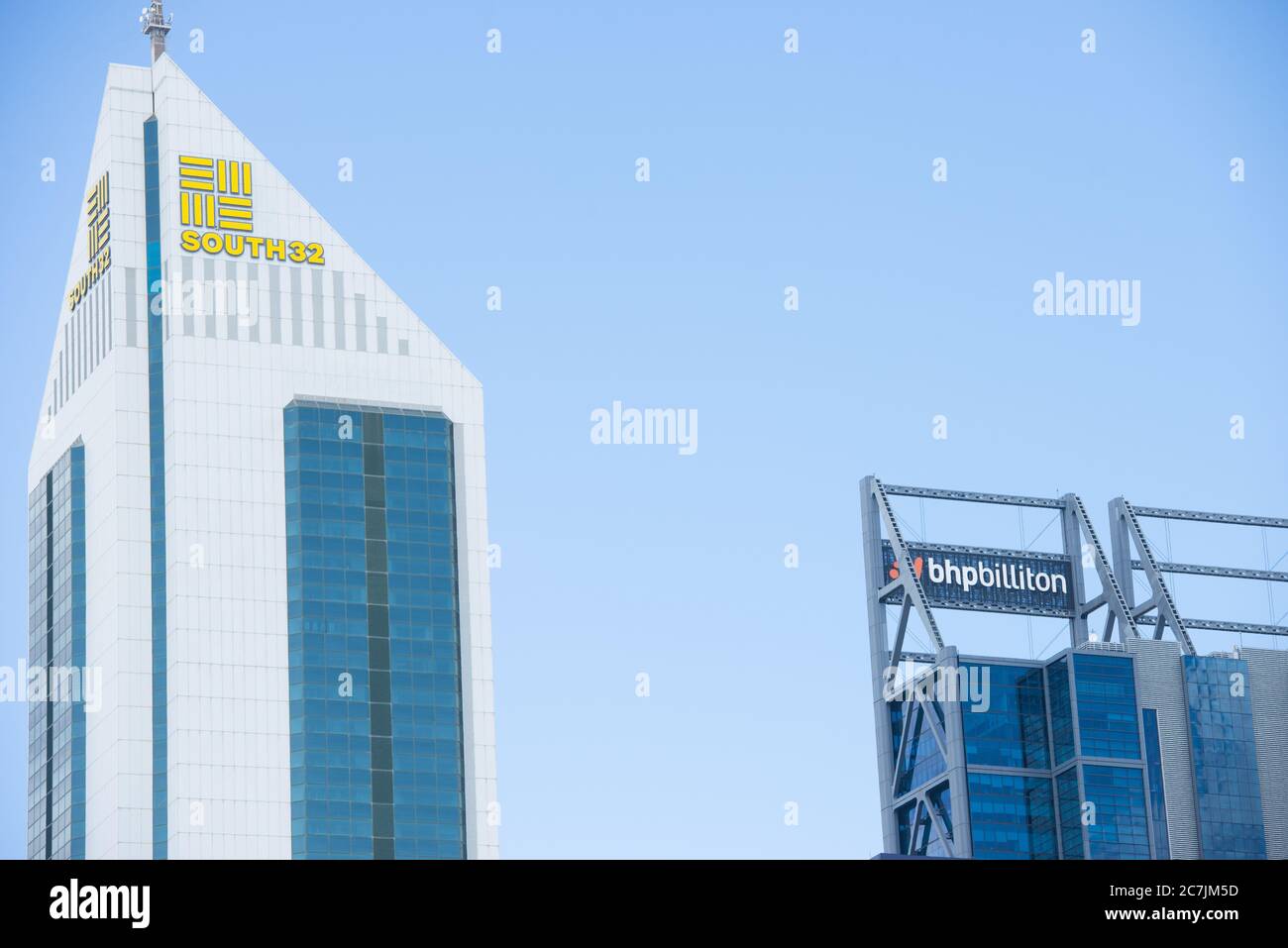 Perth, Western Australia - February 21, 2017: Office buildings of BHP Biliton and subsidiary company South32, two big mining companies , with regional Stock Photo