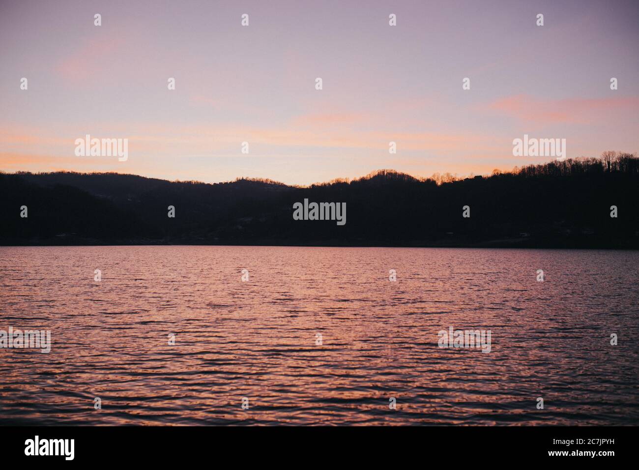 Scenery of a breathtaking sunset over the calm sea Stock Photo - Alamy