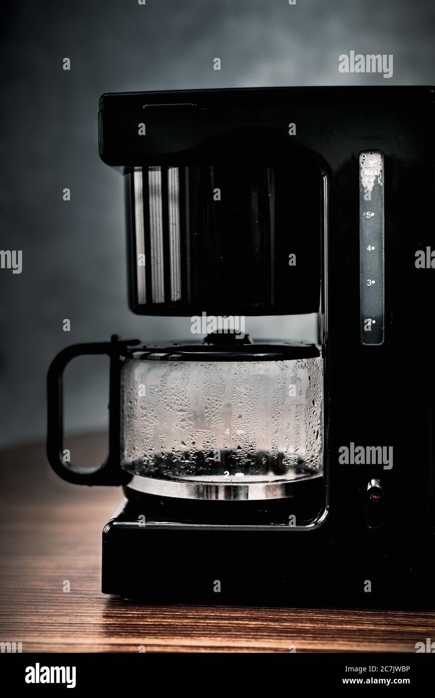 Old coffee maker (called moka or mocha) for italian coffee espresso  with open lid seen through a magnifying glass - Concept image Stock Photo -  Alamy