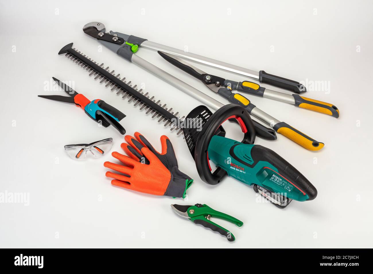 Cordless hedge trimmer, Bosch AHS 55-20 LI, rose pruner, gardening gloves,  safety glasses, grass shears, branch shears, hand hedge trimmer, white  background Stock Photo - Alamy