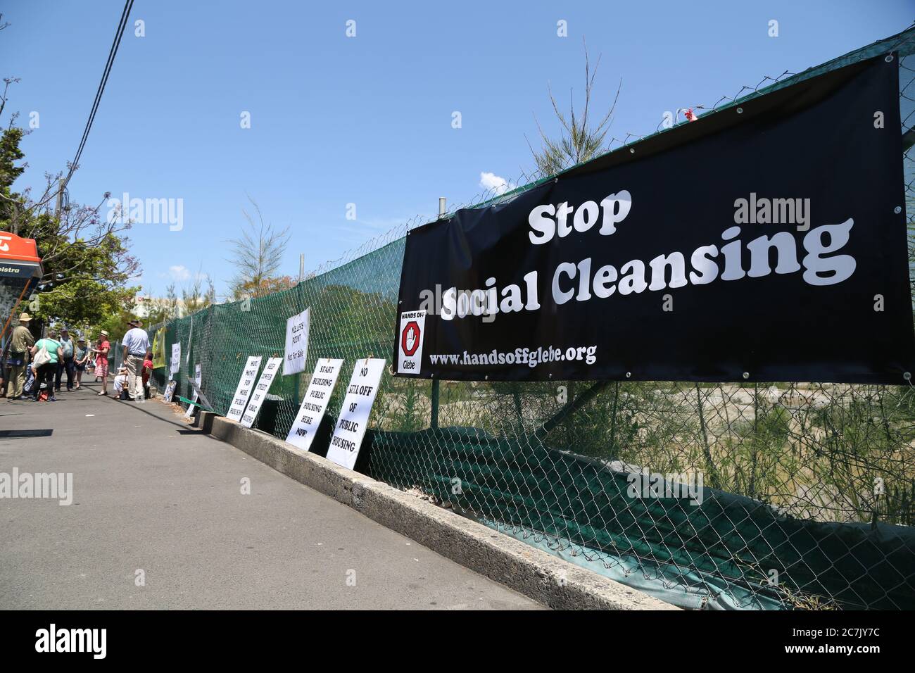 A banner saying, ‘Stop Social Cleansing’ is attached to the vacant Cowper Street site in Glebe. Public housing on the site was demolished and the prot Stock Photo