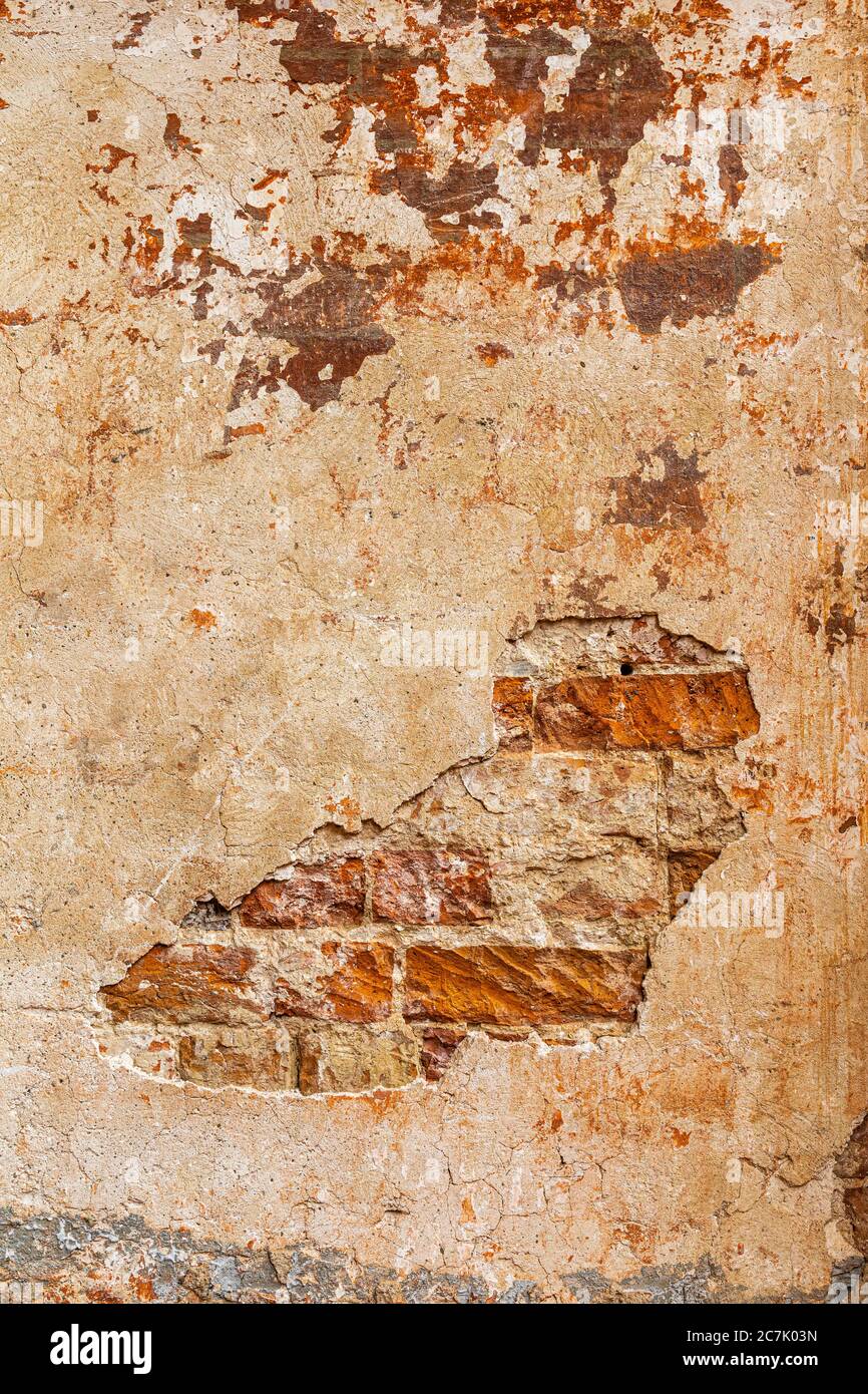 Old wall with bricks, house facade, background picture Stock Photo