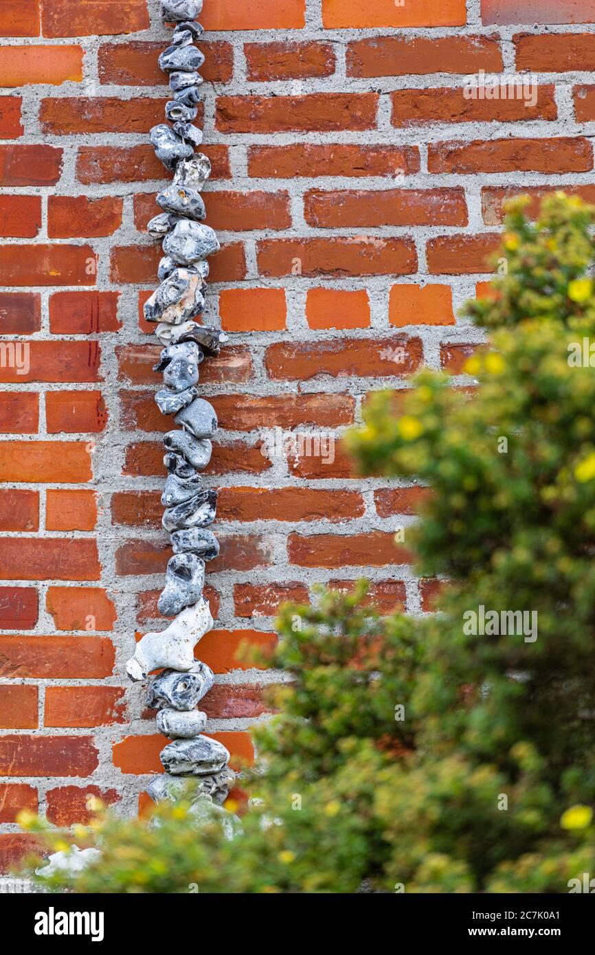 Chain of flints on a wall, decoration Stock Photo