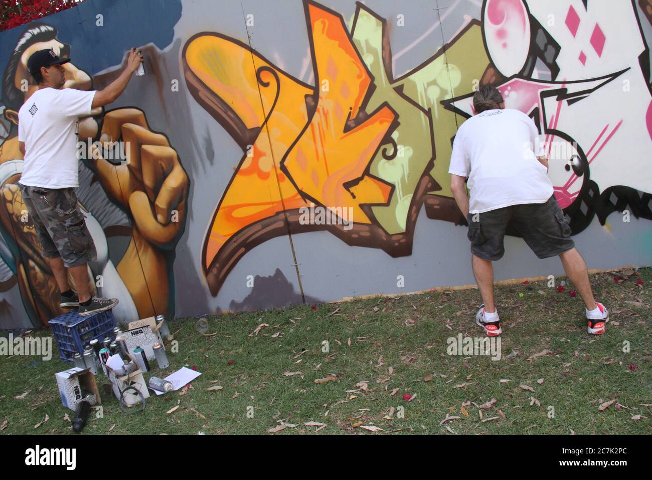 Graffiti Artists Phibs, Peque and Unique decorated a wall at the Live