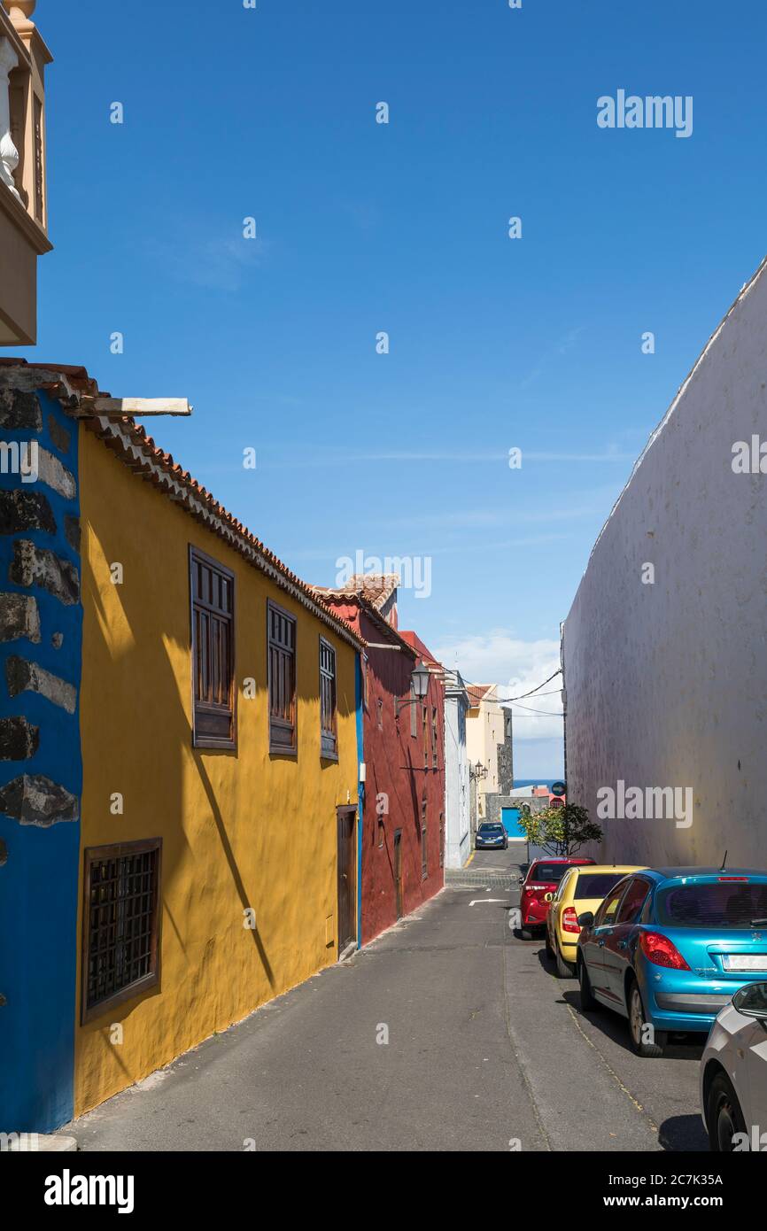 Colorful row of houses and cars in Garachico, Tenerife, Canary Islands, Spain Stock Photo