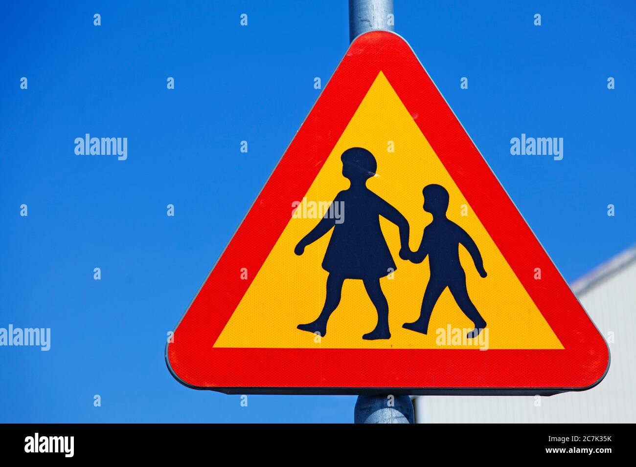traffic sign warning for children crossing the road Stock Photo