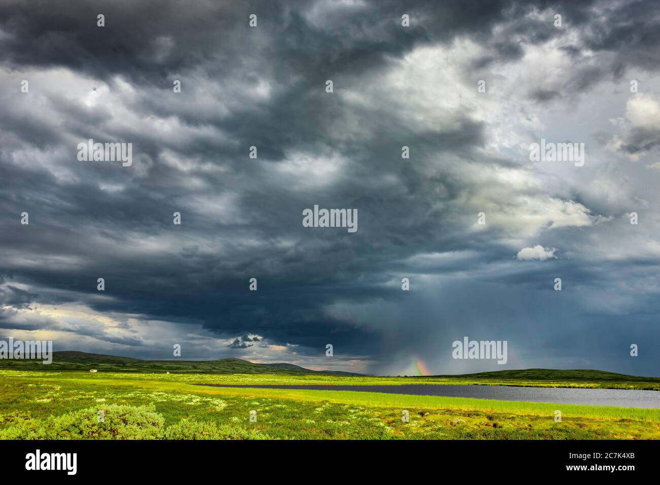Rain clouds over the Venabygdsfjell in the Rondane National Park in Norway Stock Photo