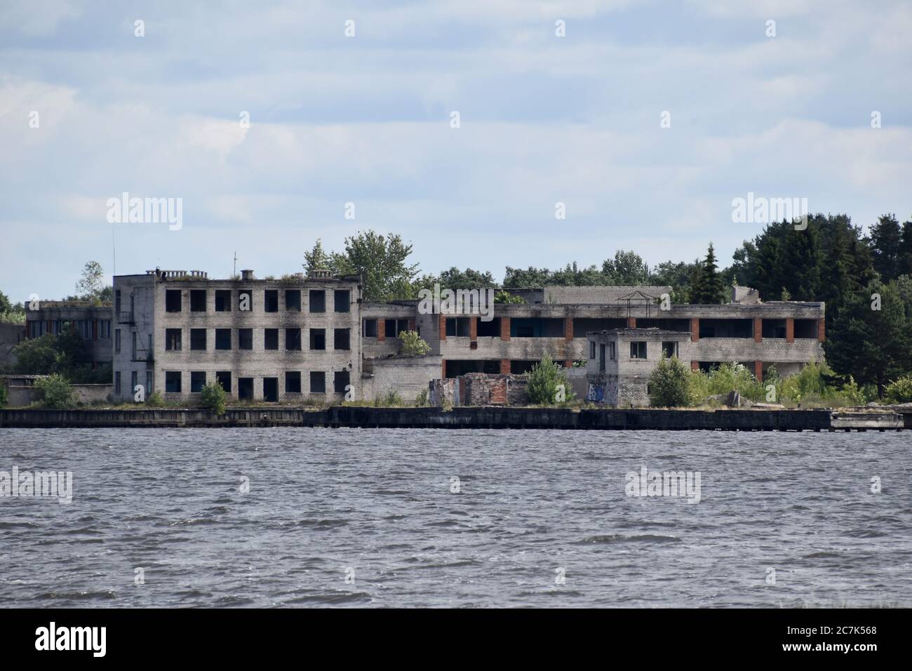 Abandoned buildings complex on the shore. Stock Photo