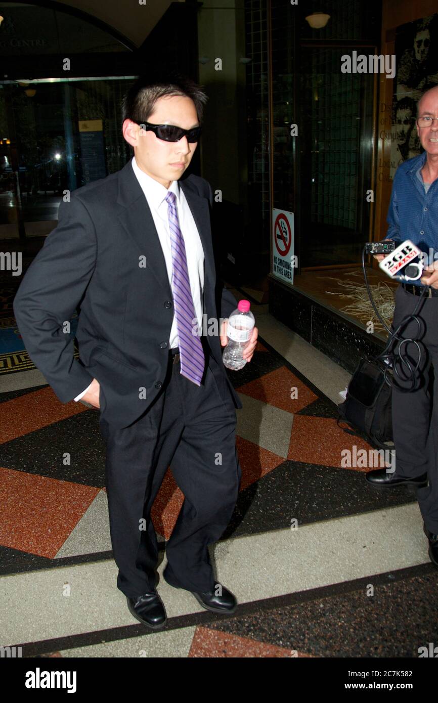 Police officer Chin Aun Lim leaves Downing Centre Court in Sydney. Stock Photo