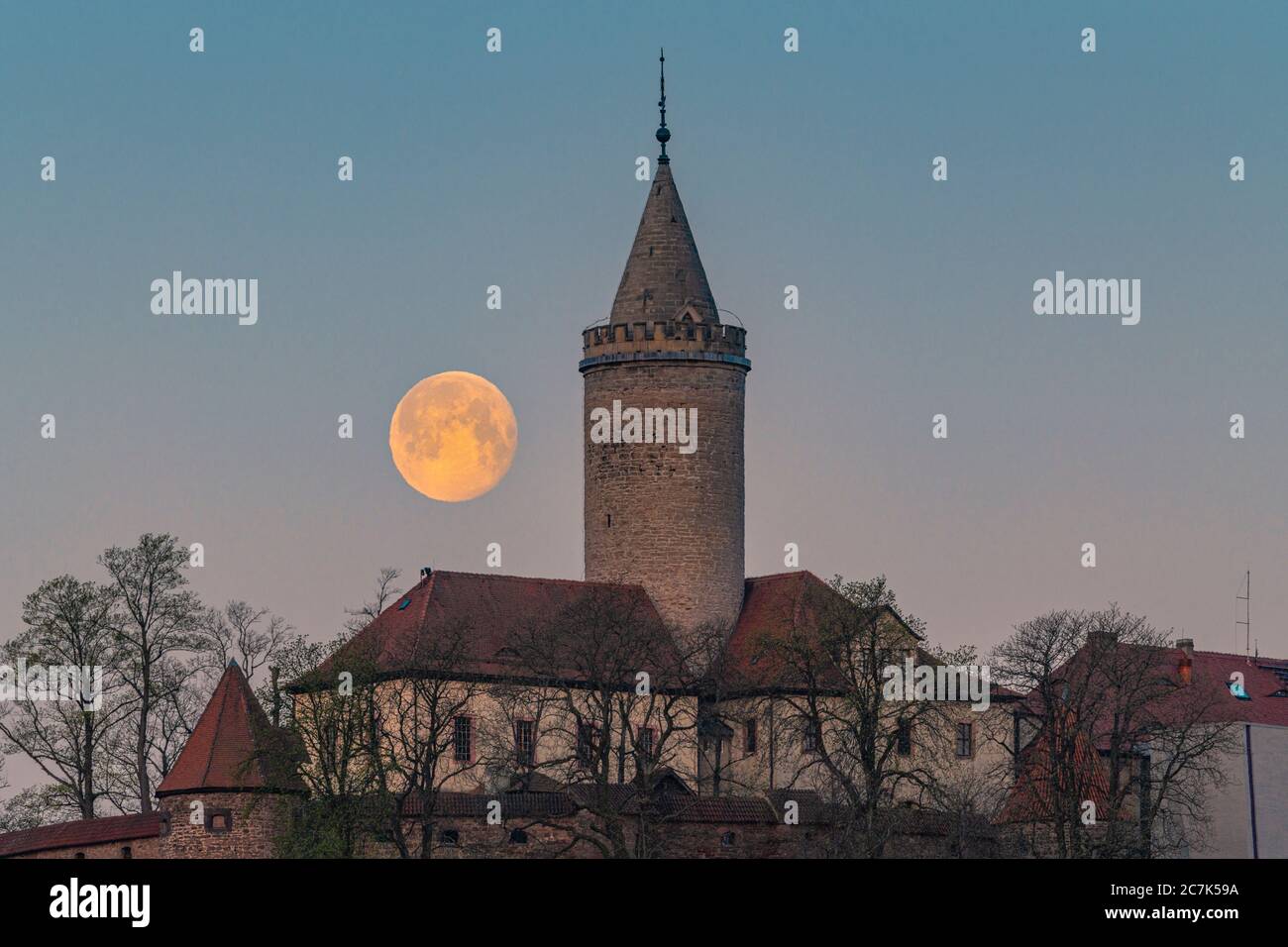 Moonset at the Leuchtenburg in Thuringia Stock Photo
