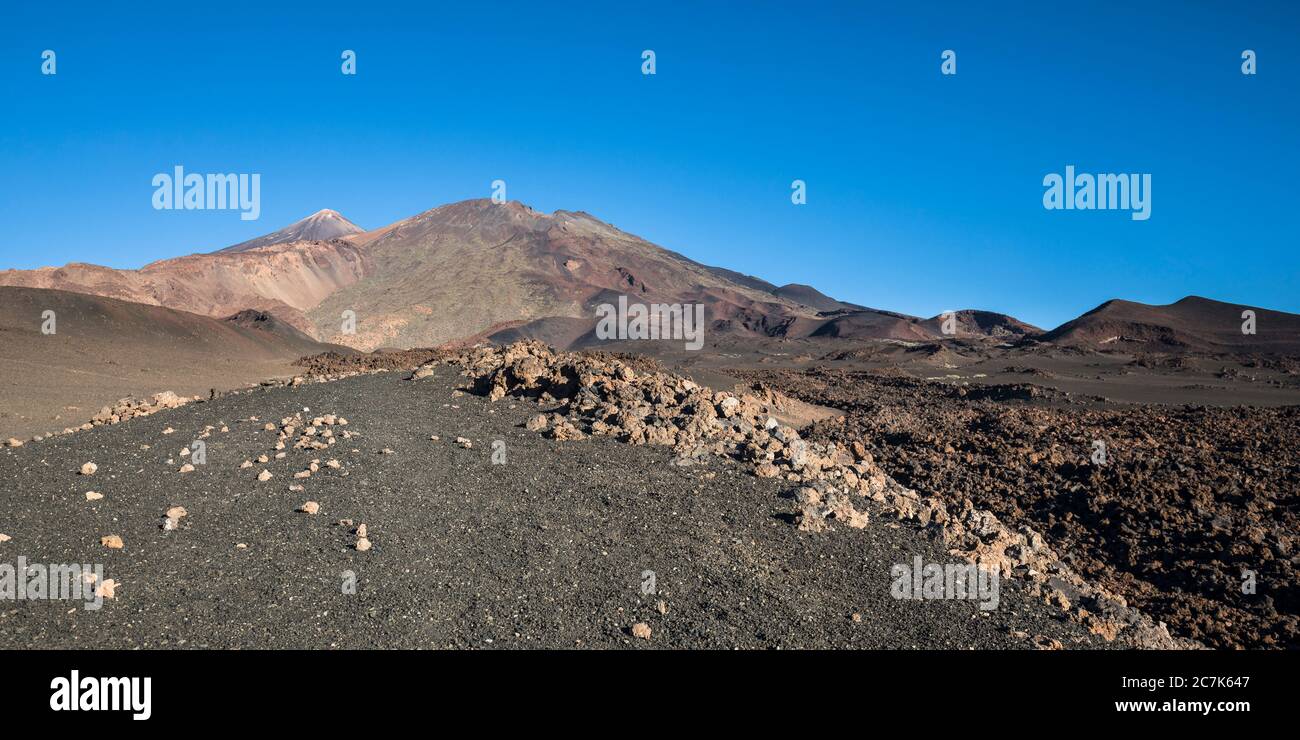 Volcanic landscape with a view of the volcanoes Pico del Teide (3718 m) and Pico Viejo (3135 m), El Teide National Park, UNESCO World Heritage, Tenerife, Canary Islands, Spain Stock Photo
