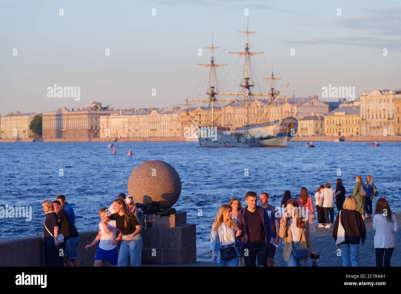 People watching historical ship Poltava anchored in Neva river during preparations to Russian Navy Day parade in St. Petersburg, Russia Stock Photo