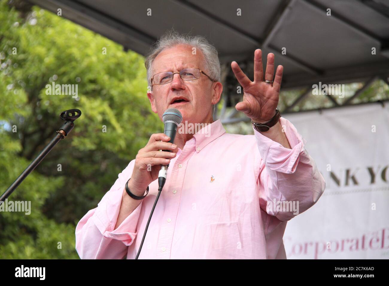 Paul Perini, Senior Minister of St Johns Anglican Church, Glebe, speaking at the official opening of the Glebe Street Fair 2014. Stock Photo