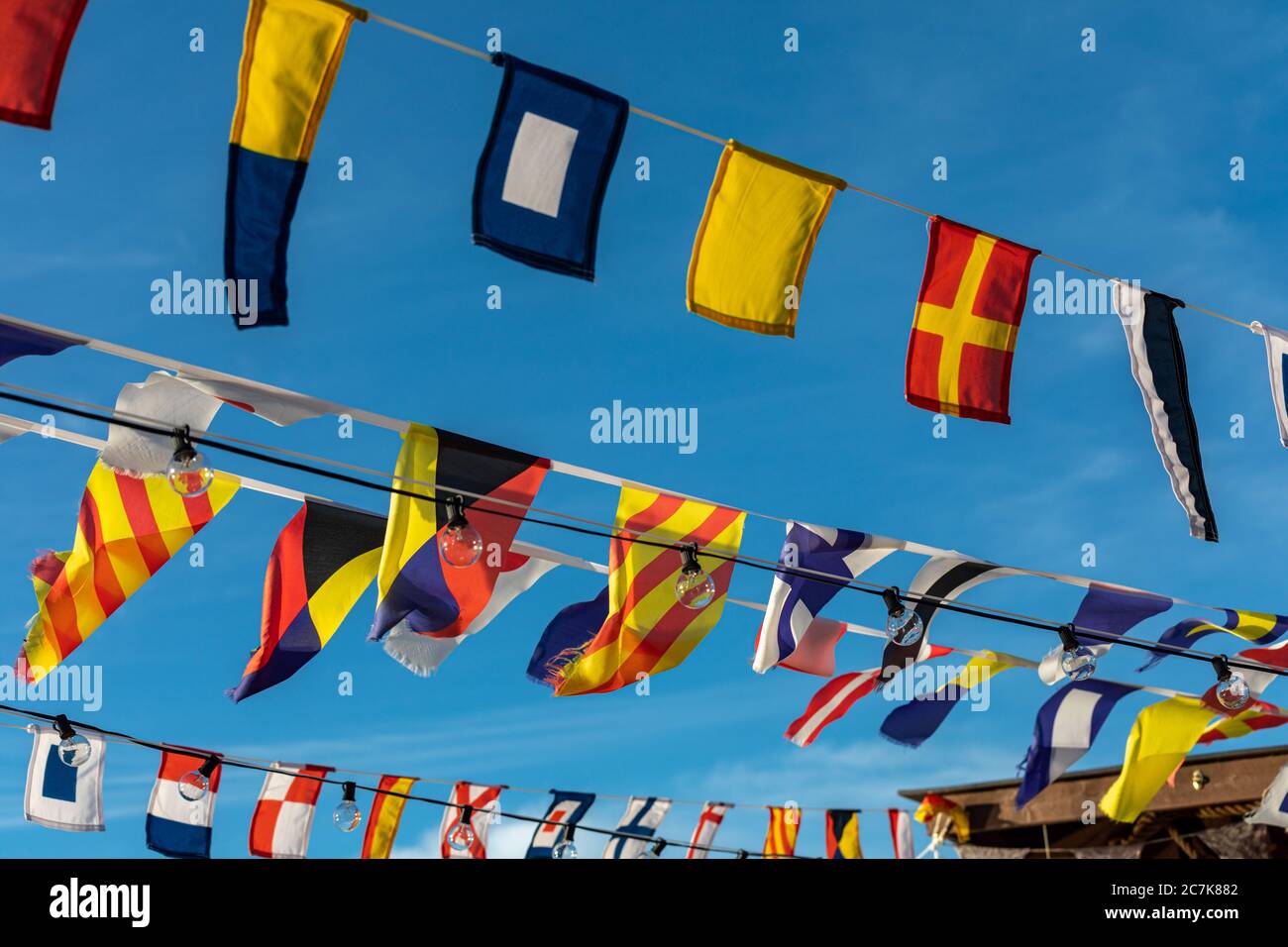 Little flags against clear blue sky Stock Photo