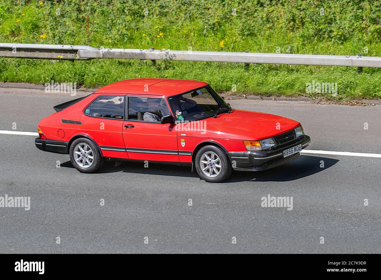 K856WOB 1992 red Saab 900 S Turbo; Vehicular traffic moving vehicles, cars driving vehicle on UK roads, motors, motoring on the M6 motorway highway network. Stock Photo