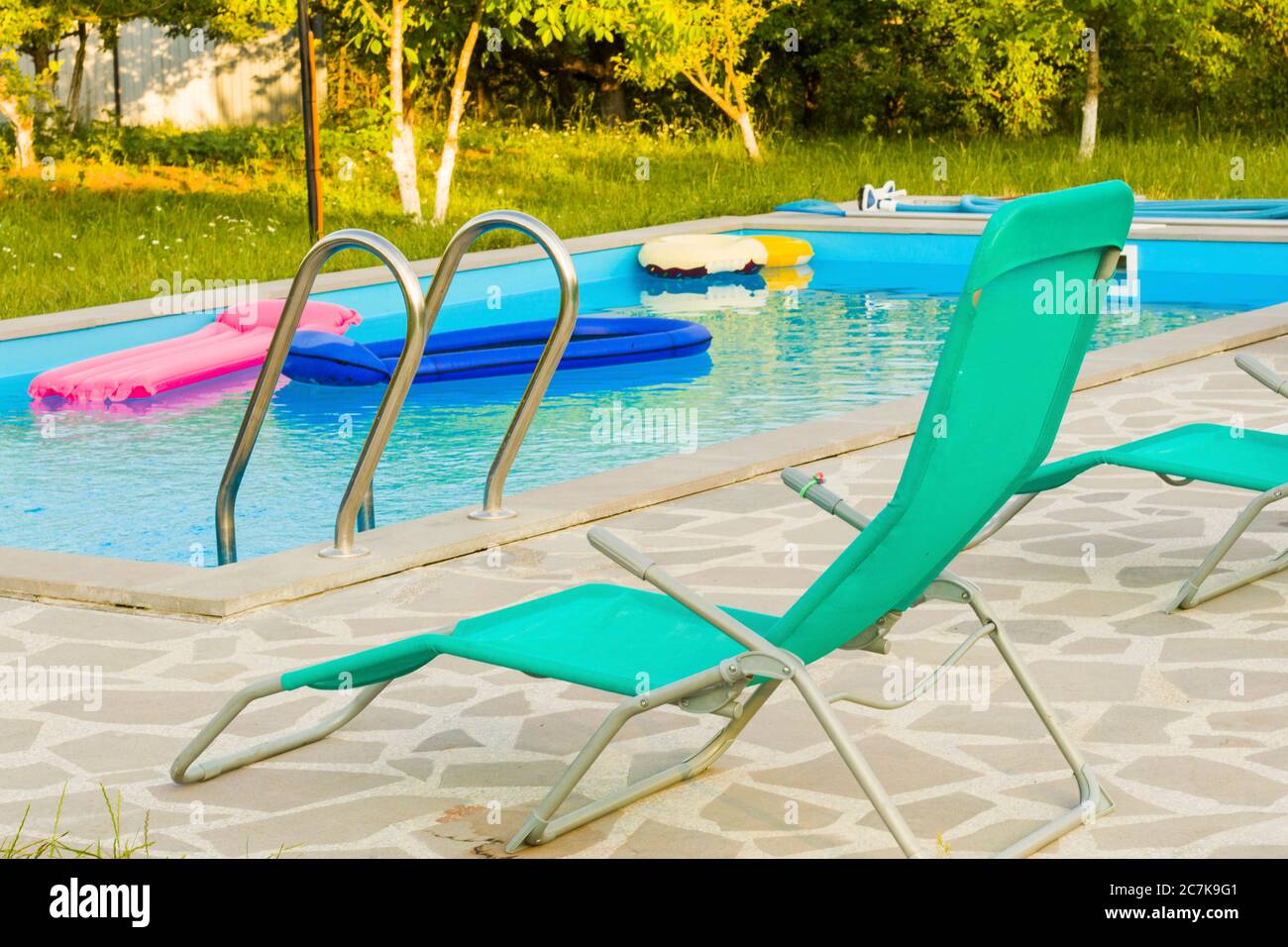 Swimming pool, summertime and empty pool, vacation and holiday, water background. Colorful summer background. Stock Photo