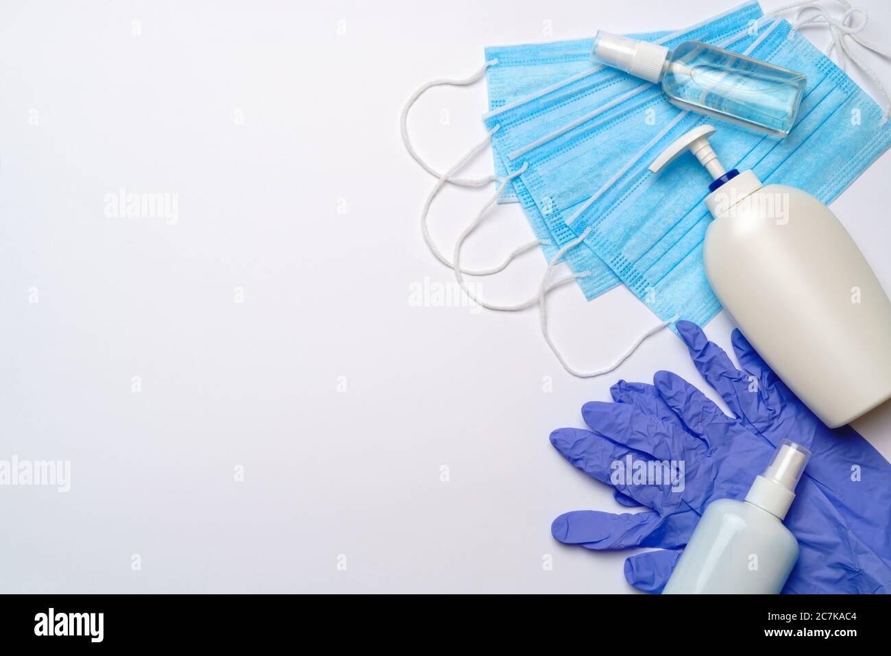 bottle of lotion, sanitizer or liquid soap, latex rubber gloves, hat