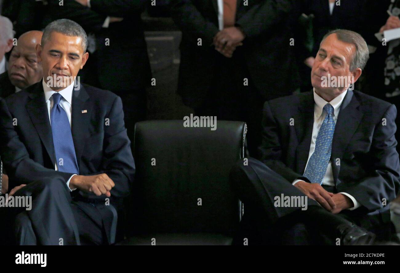 United States President Barack Obama, left, and the current Speaker of the U.S. House John Boehner (Republican of Ohio), right, attend a memorial service honoring former Speaker of the U.S. House Thomas S. Foley (Democrat of Washington) in the U.S. Capitol in Washington, DC on October 29, 2013. Foley represented Washington's 5th Congressional District was the 57th Speaker of the US House of Representatives from 1989 to 1995. He later served as US Ambassador to Japan from 1997 to 2001. U.S. Representative John Lewis (Democrat of Georgia) is at the far left behind President Obama.Credit: Aud Stock Photo