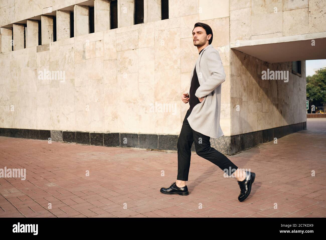 Cool young man walking city hi-res stock photography and images - Alamy