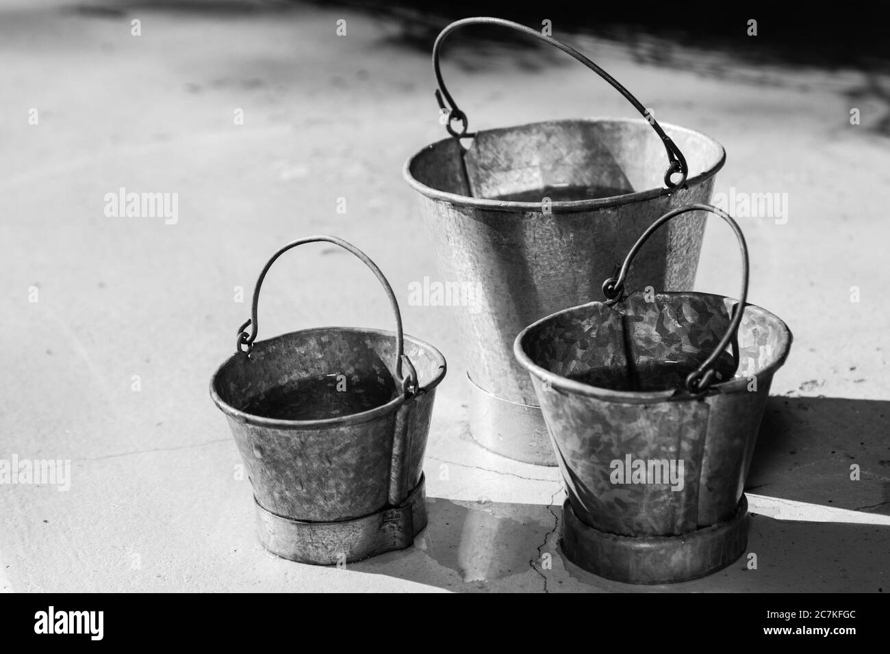 Three shiny buckets Black and White Stock Photos & Images Alamy