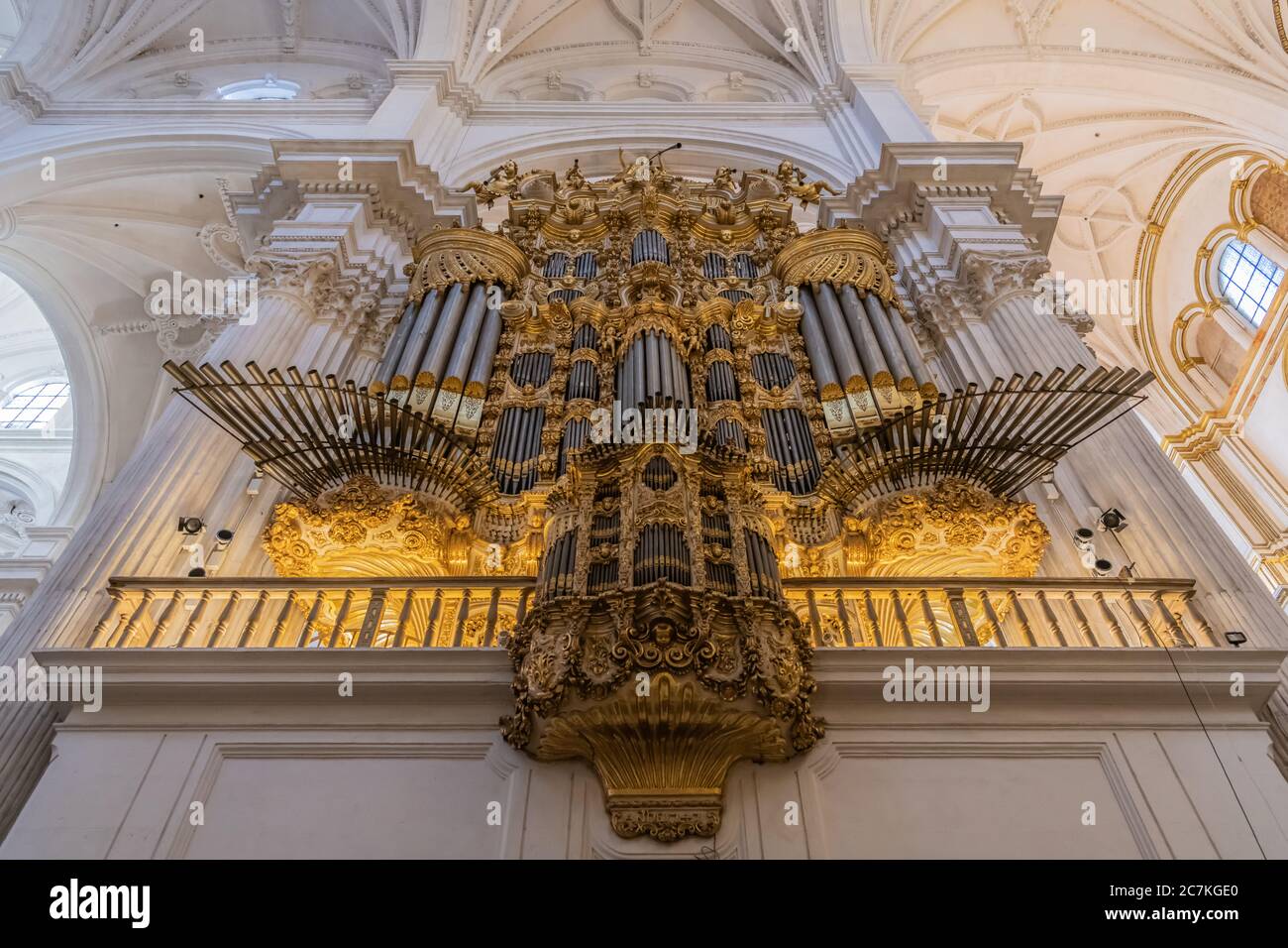 The monumental facade of Leonardo Ávila's baroque 'Epistle' pipe organ in Granada Cathedral. Completed in 1749 it is in an Iberian baroque style. Stock Photo