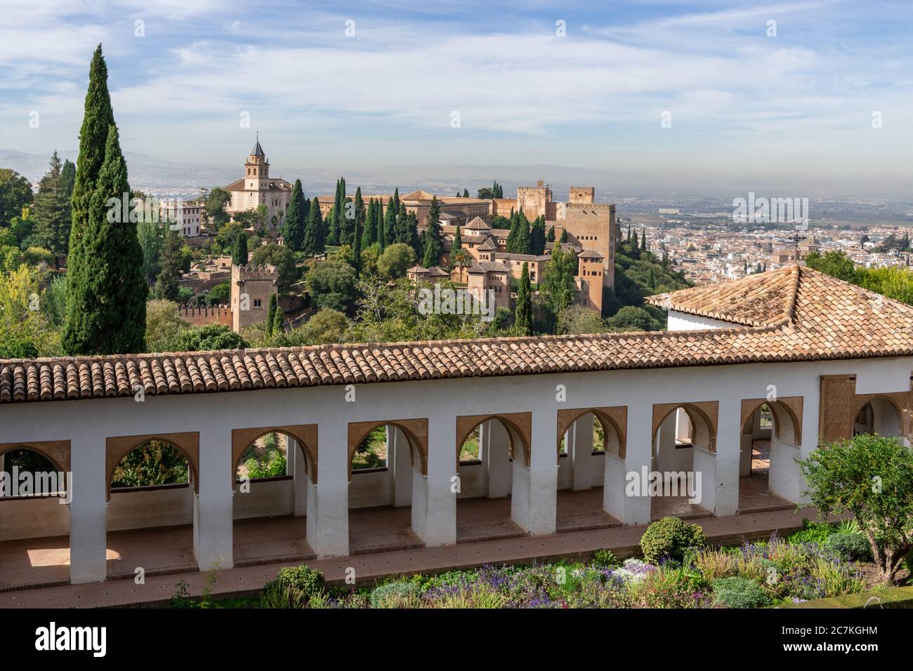 A view of the Alhambra, Alcazaba and West Wall of the Generalife with Granada in the distance Stock Photo