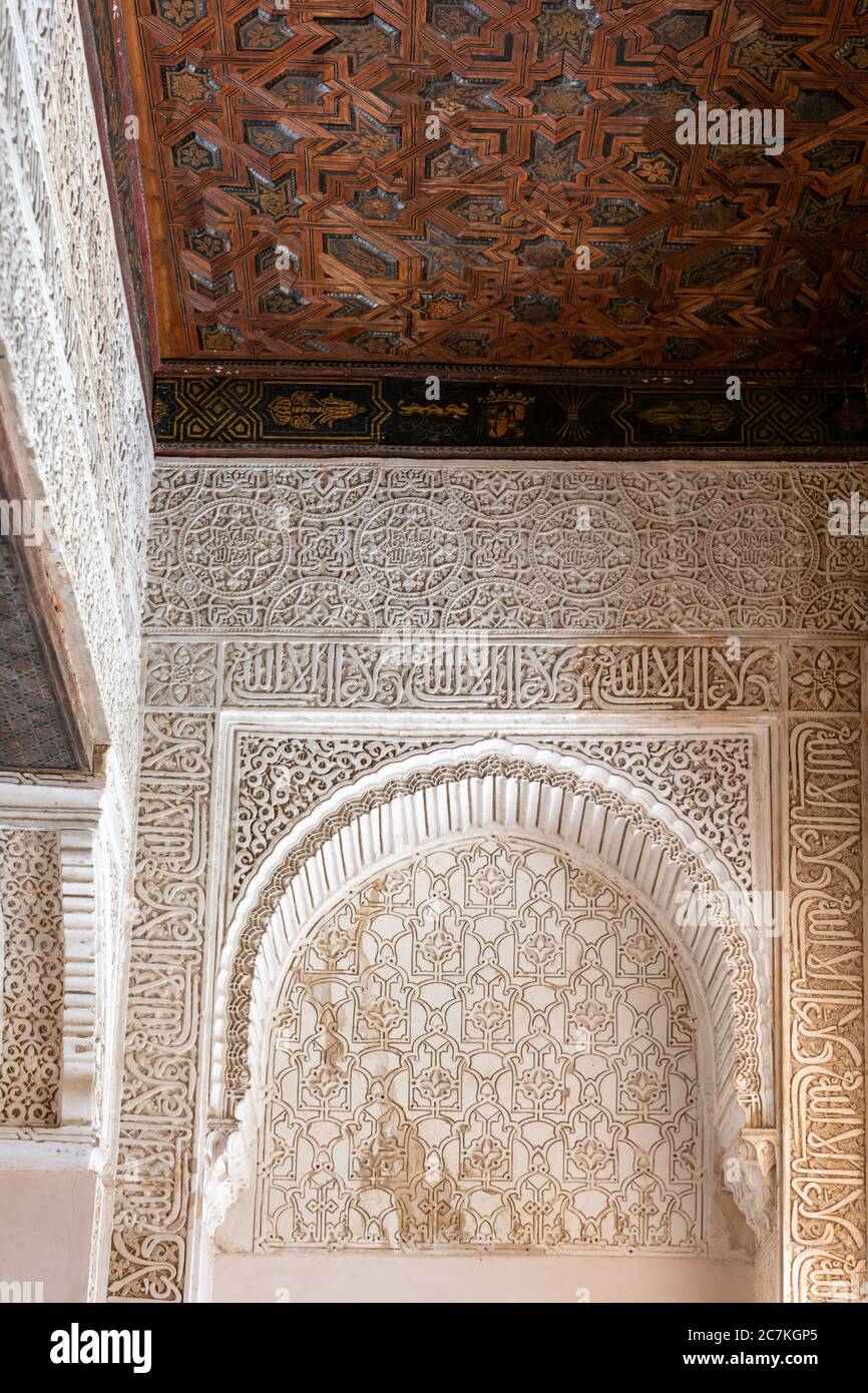 Ornate islamic decoration borders an elaborate wooden coffered ceiling  in the Hall of the Mexuar. Stock Photo